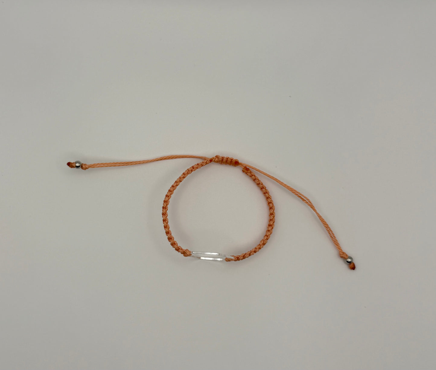 “Coral” macrame knotted bracelet with hexagon charm