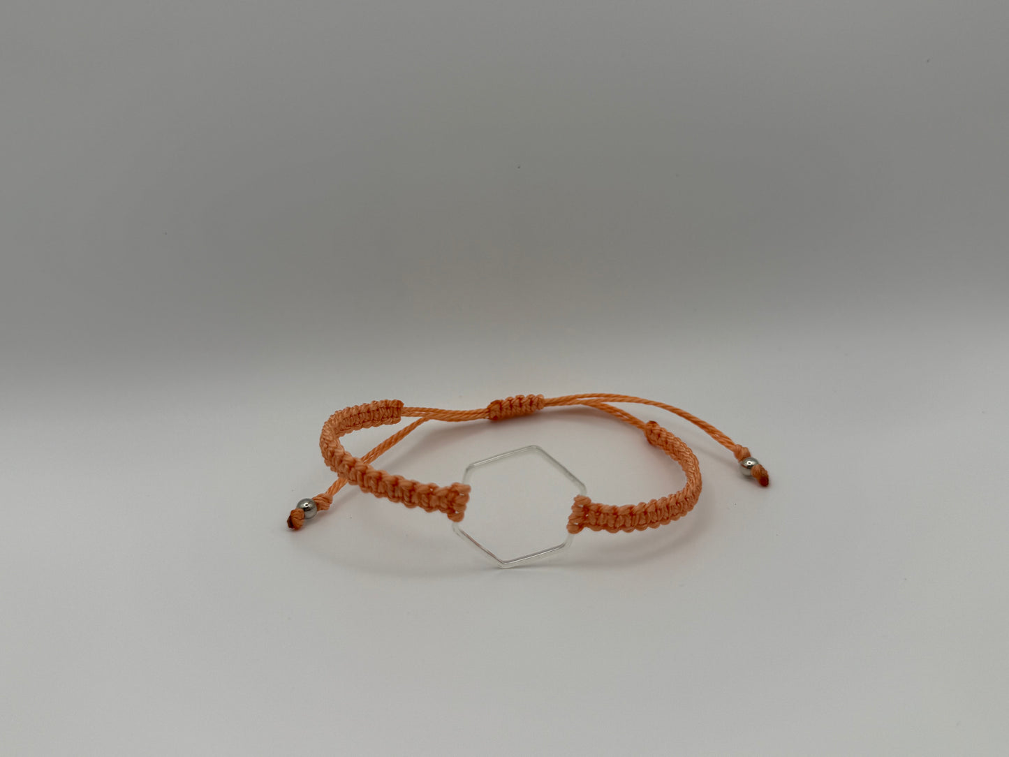 “Coral” macrame knotted bracelet with hexagon charm