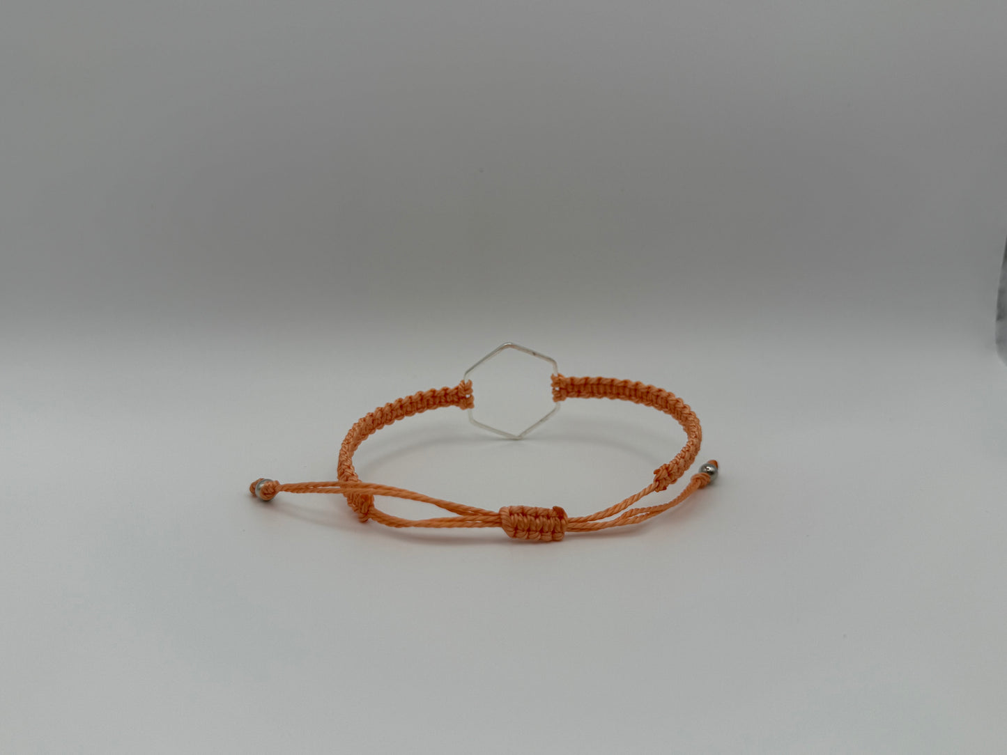 “Coral” macrame knotted bracelet with hexagon charm