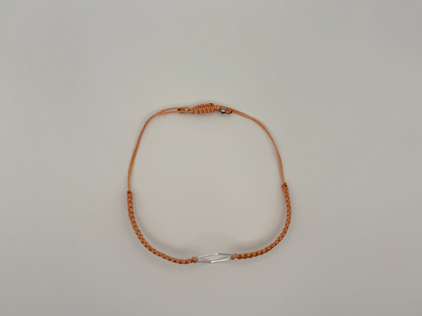 “Coral” macrame knotted bracelet with hexagon charm